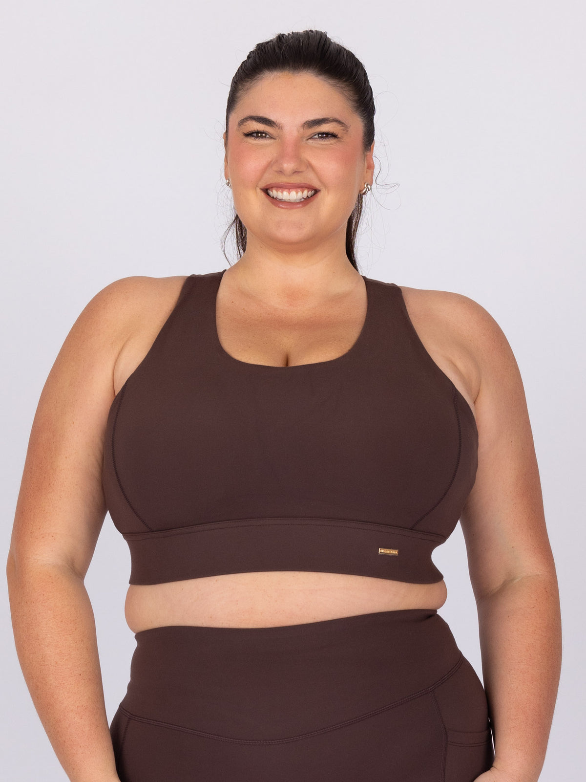 Maddie is wearing our Bra in size C - (E - HH). She is AUS 16, Cup F.